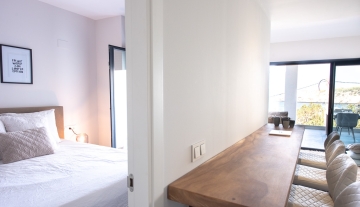 Resa Estates Ibiza te koop appartement Vadella Mar zee zicht woonkamer slaapkamer.jpg